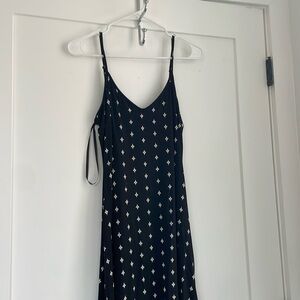 Ankle length black dress with white details